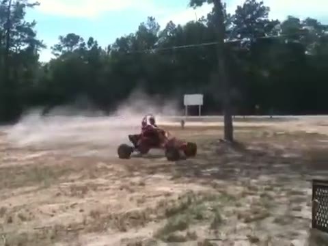 The red Arachnid sliding across a dirt lot