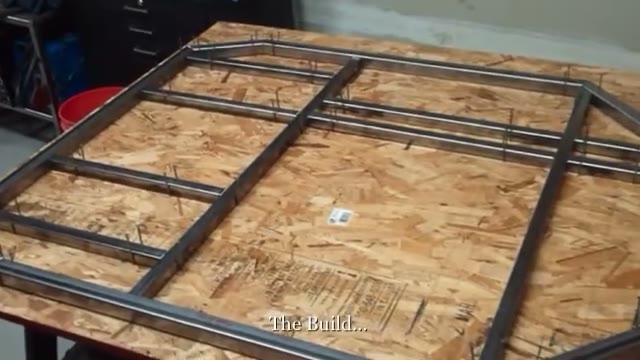 GrandDaddy go kart frame laid out on a plywood work table