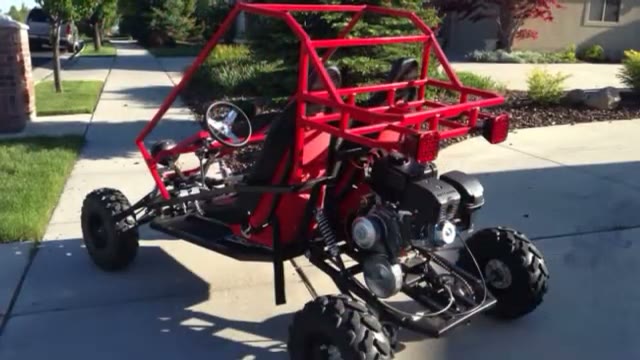 Finished gloss-red GrandDaddy buggy on a driveway