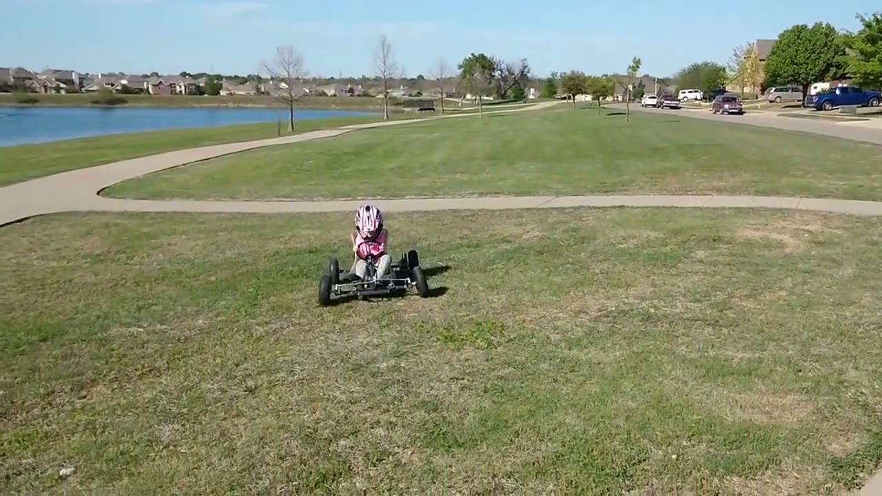 A bare-metal SpiderCarts Itzy Bitzy kids kart on its first ride