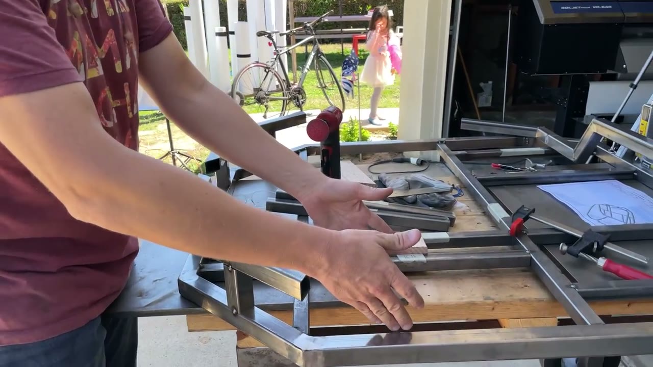 Clamping and squaring frame members on a work table