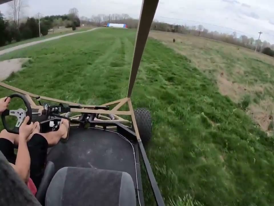 Point of view from the seat of the GrandDaddy driving across a field