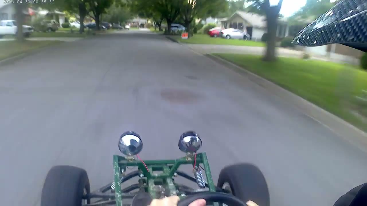 POV of the Arachnid rounding a corner on a residential street