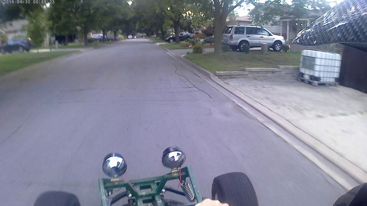 Helmet-cam view over the front of a green SpiderCarts Arachnid