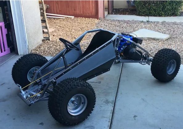 Bare-metal buggy frame finished in a home driveway