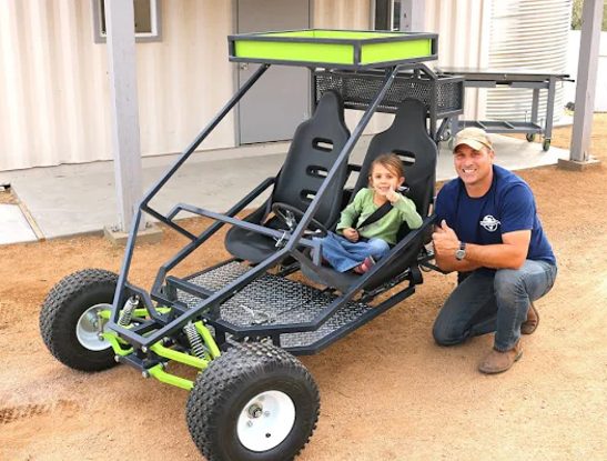 Father and son with their finished GrandDaddy buggy
