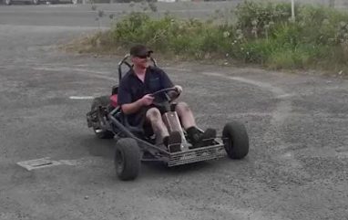 Builder driving his Scorpion on a gravel lot
