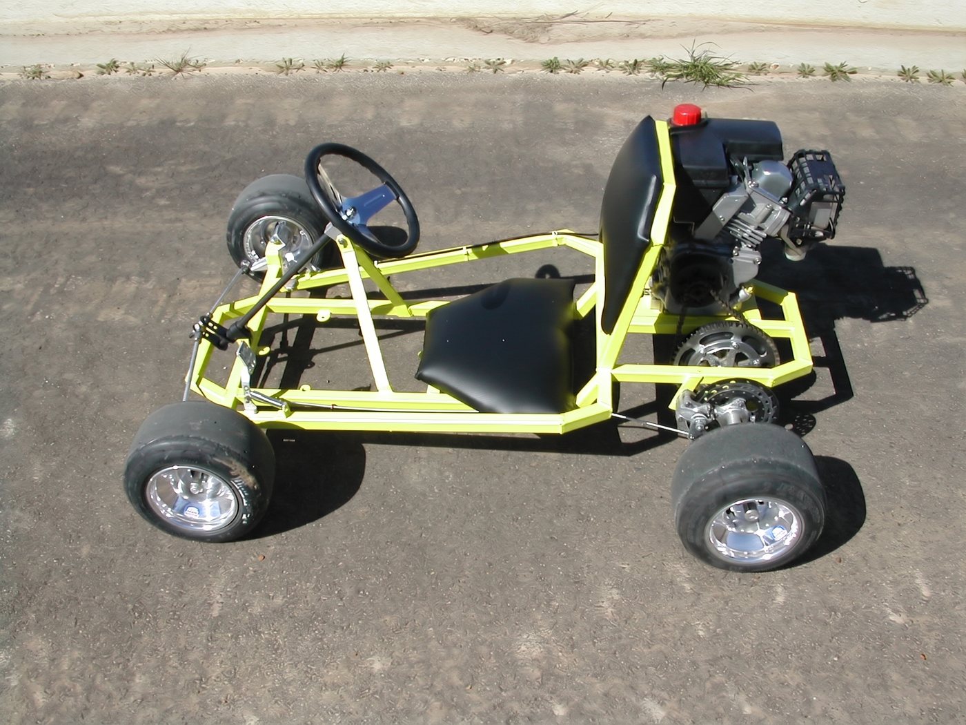 Recluse yellow racing go kart, front three-quarter