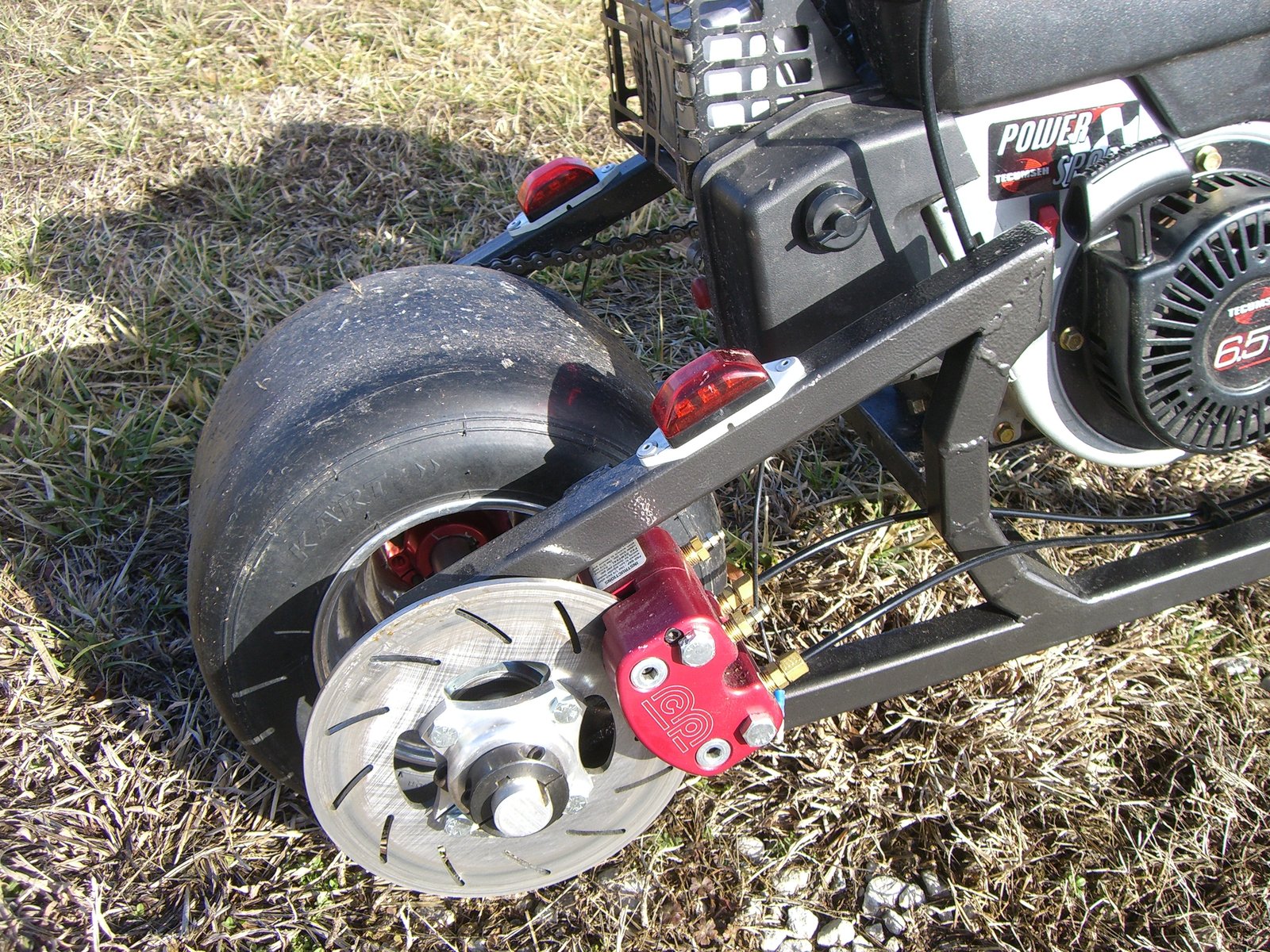 Scorpion rear wheel, disc brake and engine detail