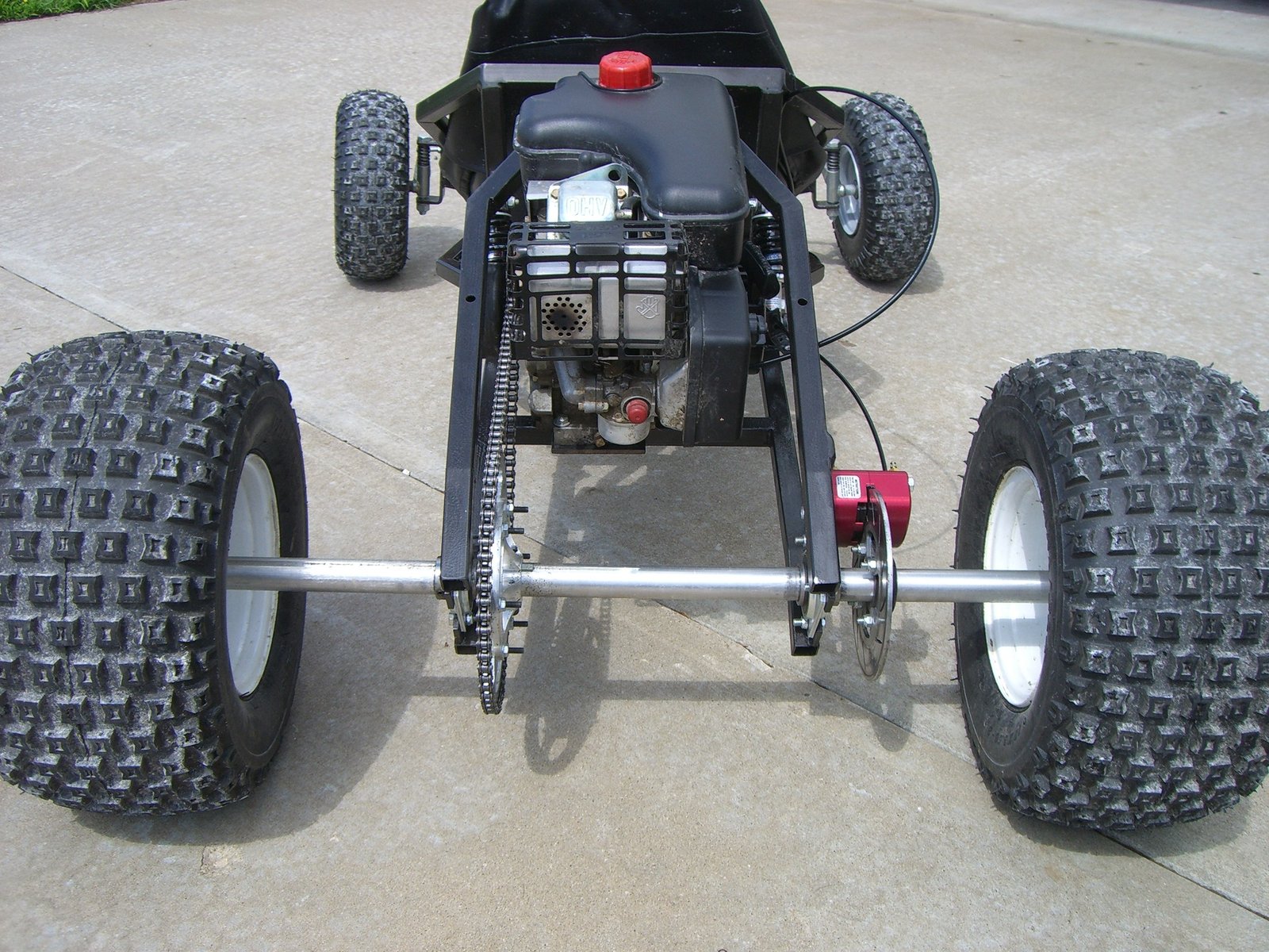 Tarantula from the rear, showing the axle, chain and knobby tires